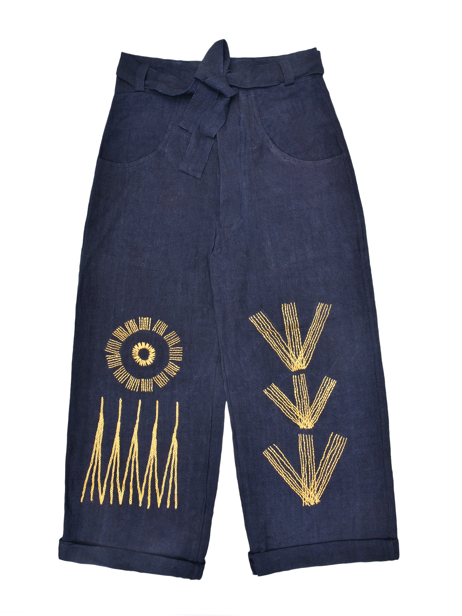 Navy pants with yellow hand embroidery on a white background