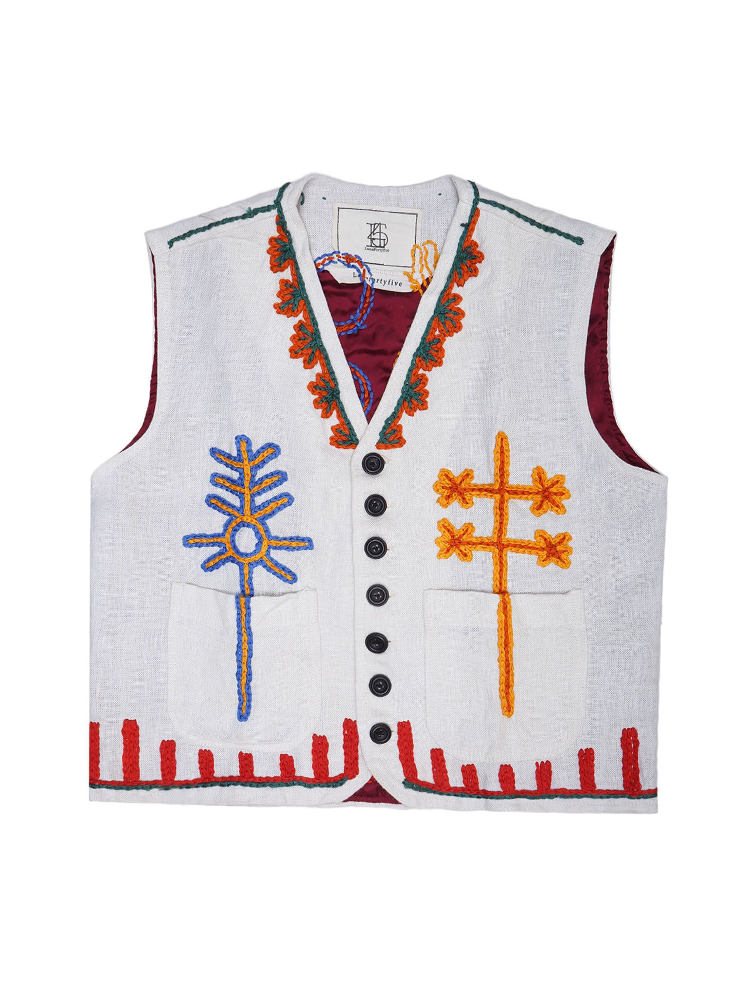 White vest with colorful embroidery on a white background