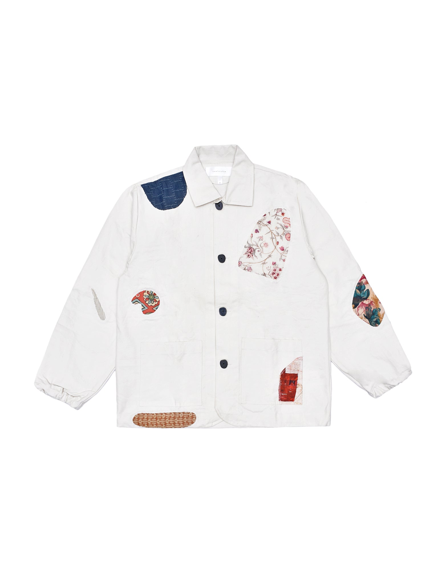 White jacket with colorful patch designs on a white background