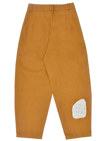 Brown pants with a white patch on a white background