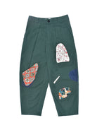 Green pants with colorful patchwork design on a white background