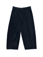 Black pleated pants on a white background