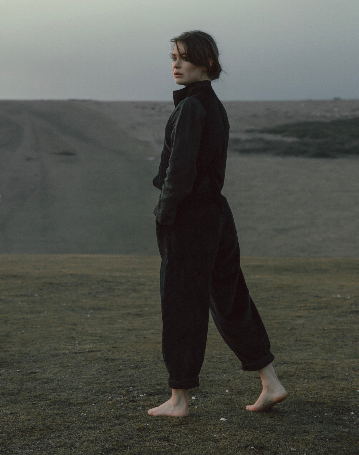 Person wearing a dark outfit standing in East sussex