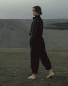 Person wearing a dark outfit standing in East sussex