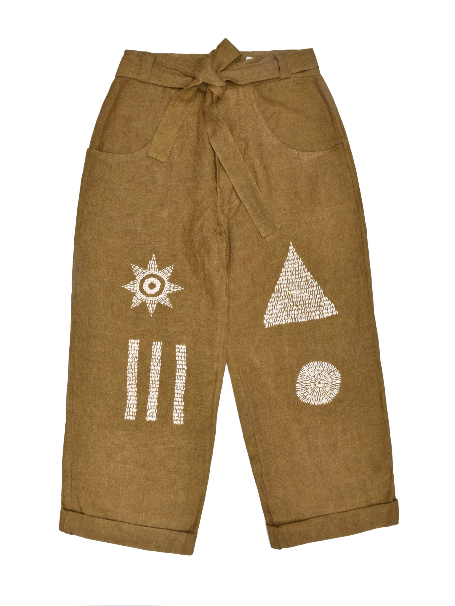 Brown pants with geometric and abstract embroidery on a white background