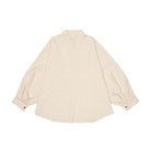 Beige blouse with balloon sleeves on a white background