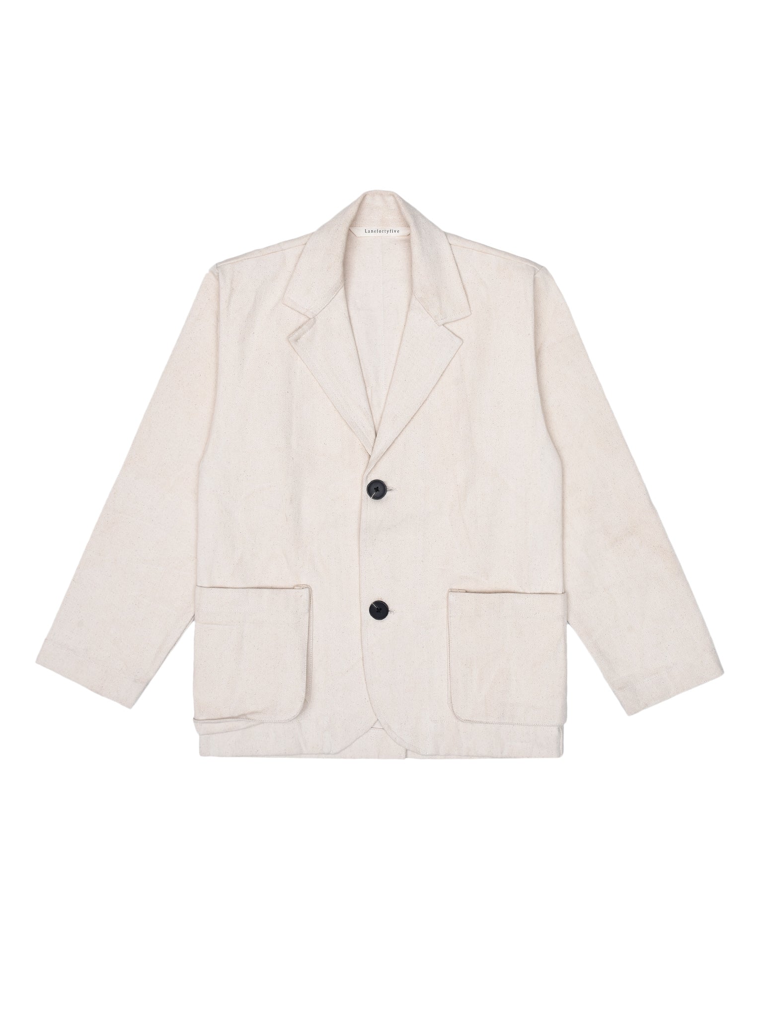 Off-white blazer with black buttons on a white background