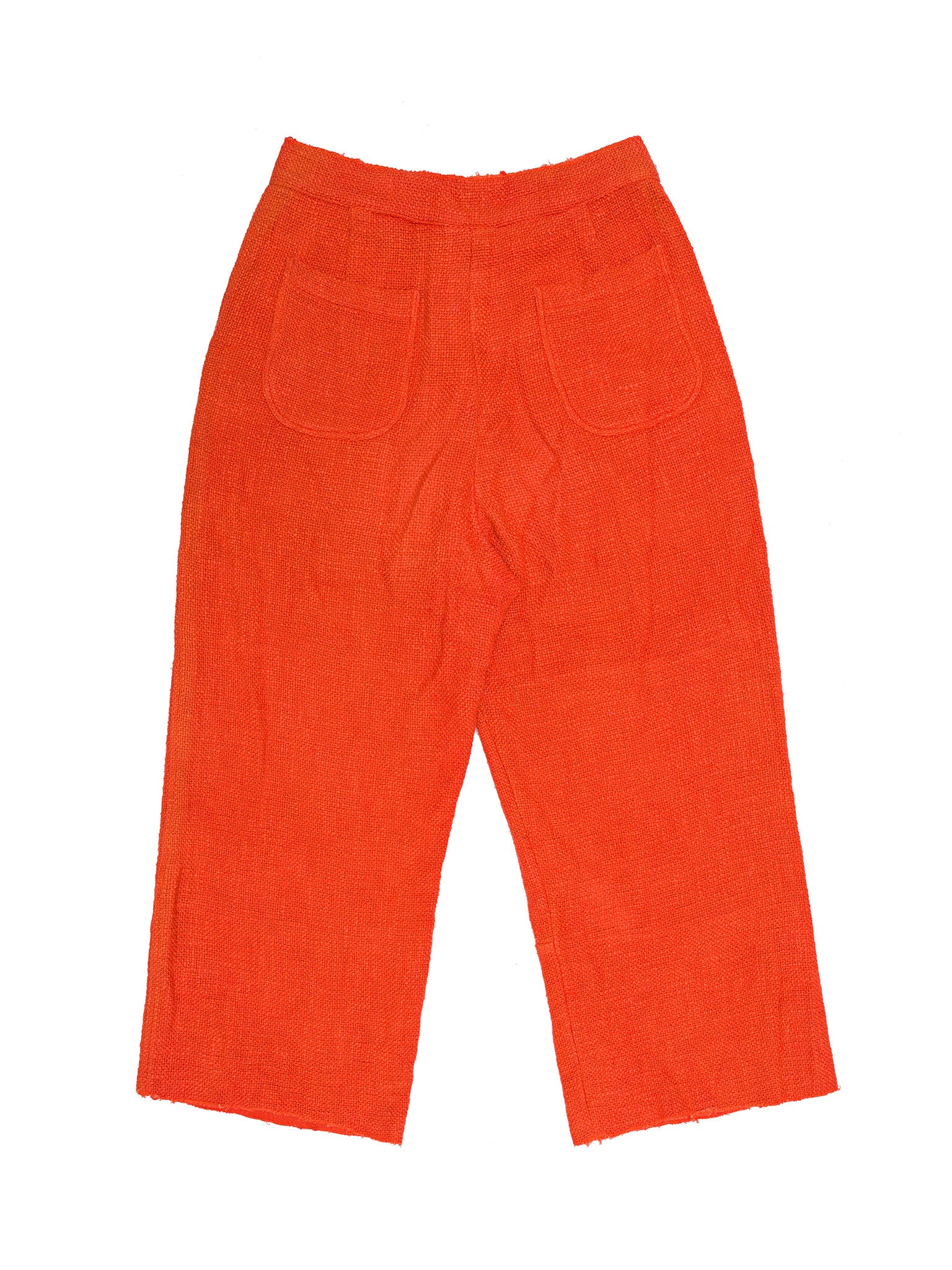 Orange corduroy pants on a white background